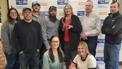 Williams employees accept the Heart of the Community award.